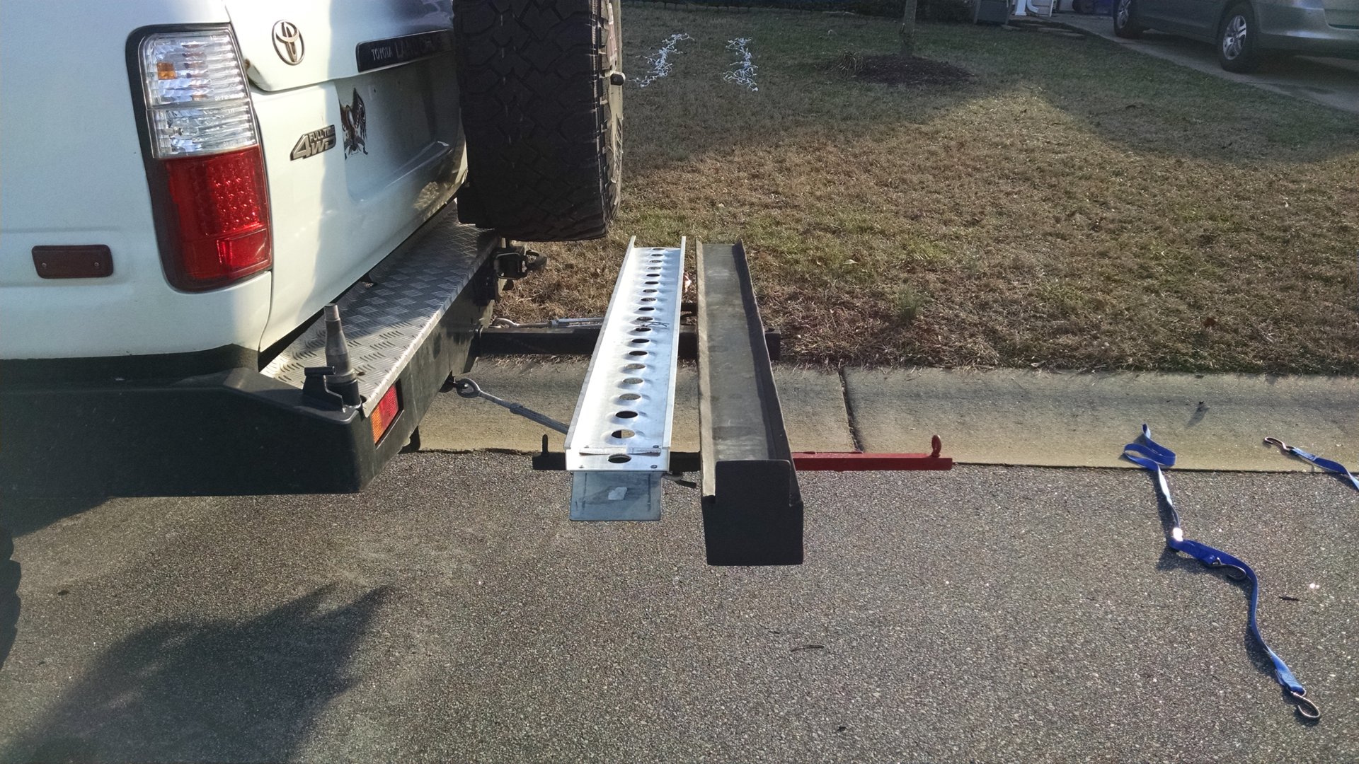 Motorcycle hitch carrier and dual swing