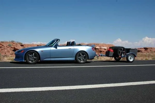 2002 S2000 and trailer heading to Vegas.webp