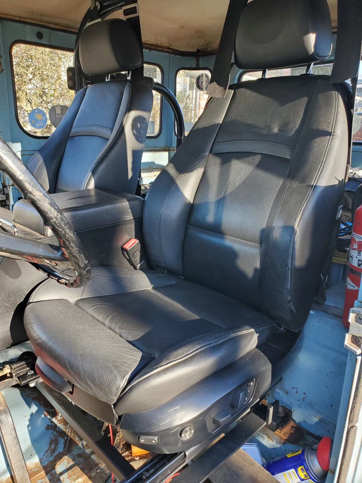 BMW 3 series seats mounted on custom frames to fit in 1974 FJ40