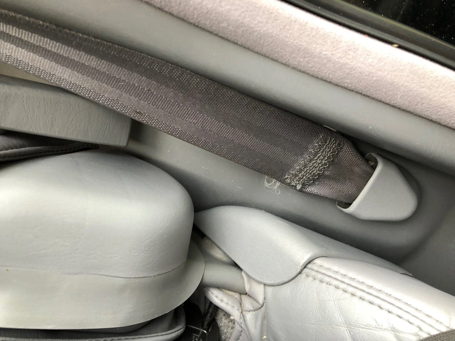 2nd row - seatbelt anchor - correct cover.webp