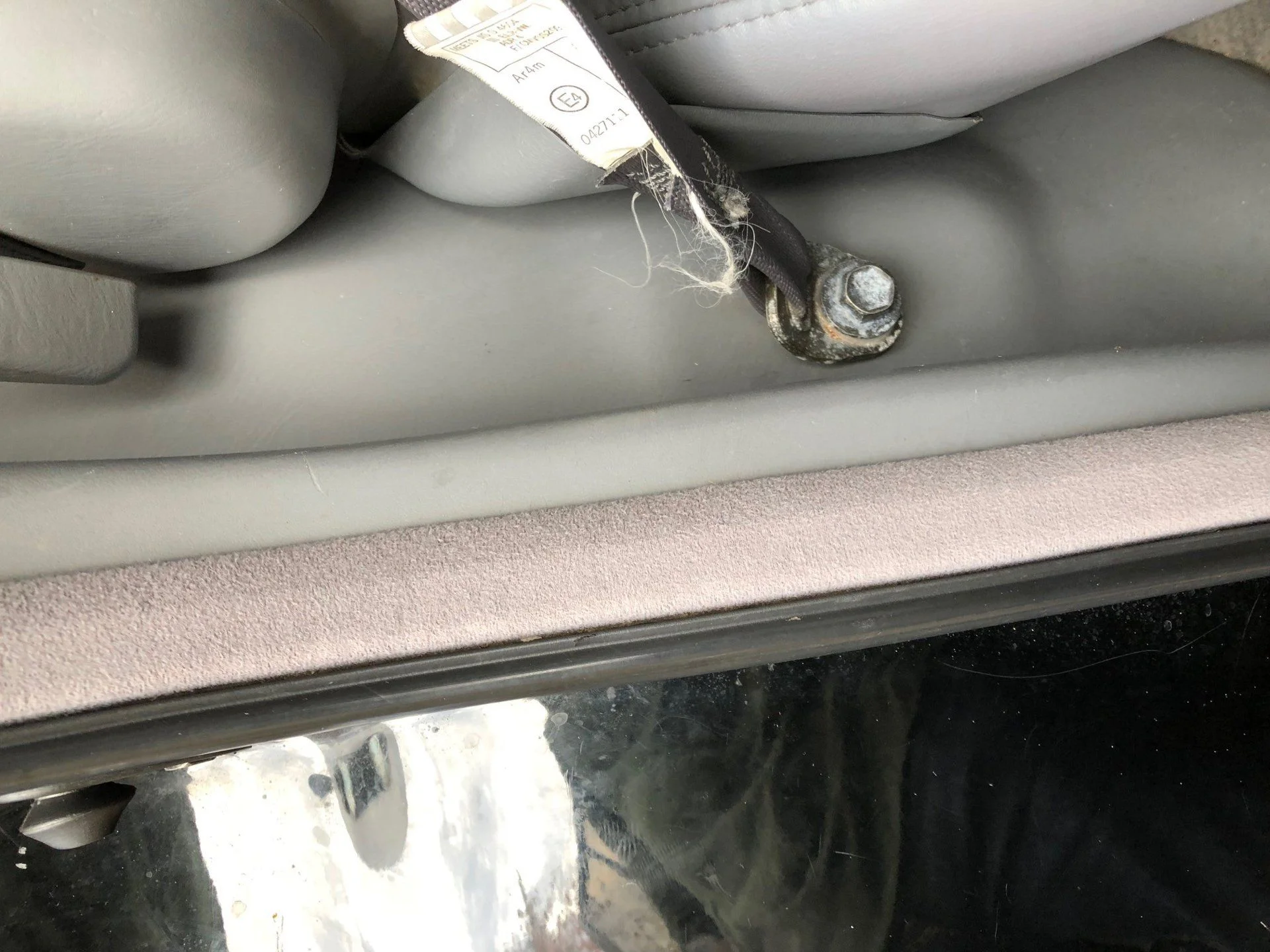 2nd row - seatbelt anchor - missing cover.webp