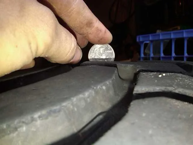 3rd from left tire tread depth.webp
