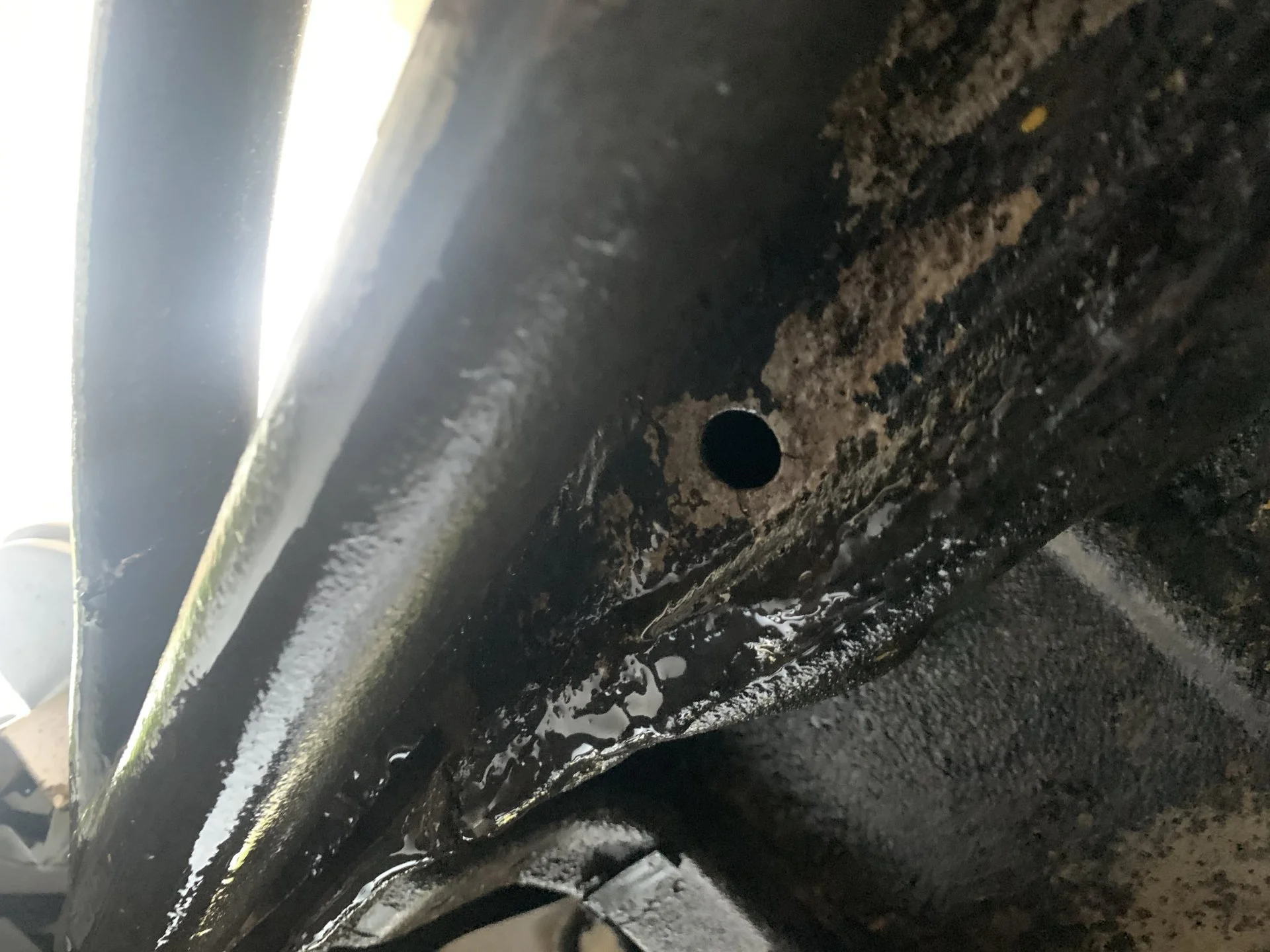 Opening drains in the rocker panel pinch welds | IH8MUD.com