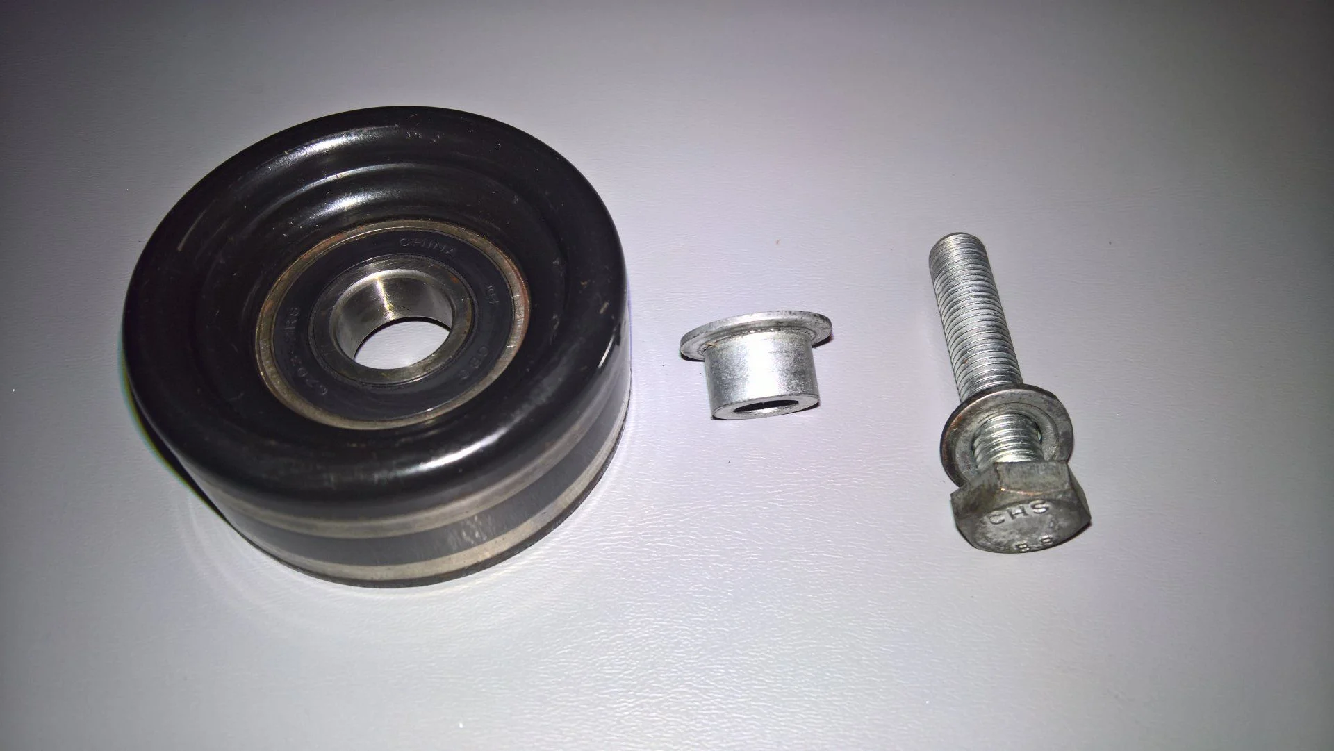Alternator idler pulley bolt collar.jpg