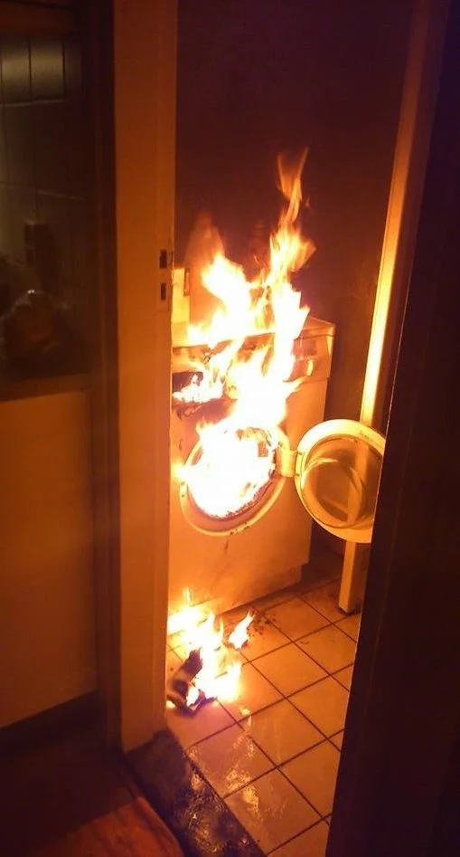 crazy-washing-machine-on-fire-burning-kitchen-1413849867A.webp