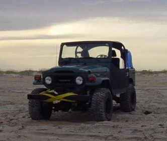 cruiser on beach.webp