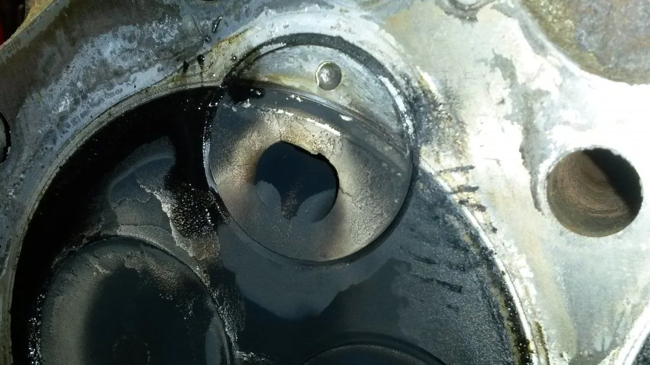 cylinder head refresh disassembly (head on bench, close-up of precup) 18.webp
