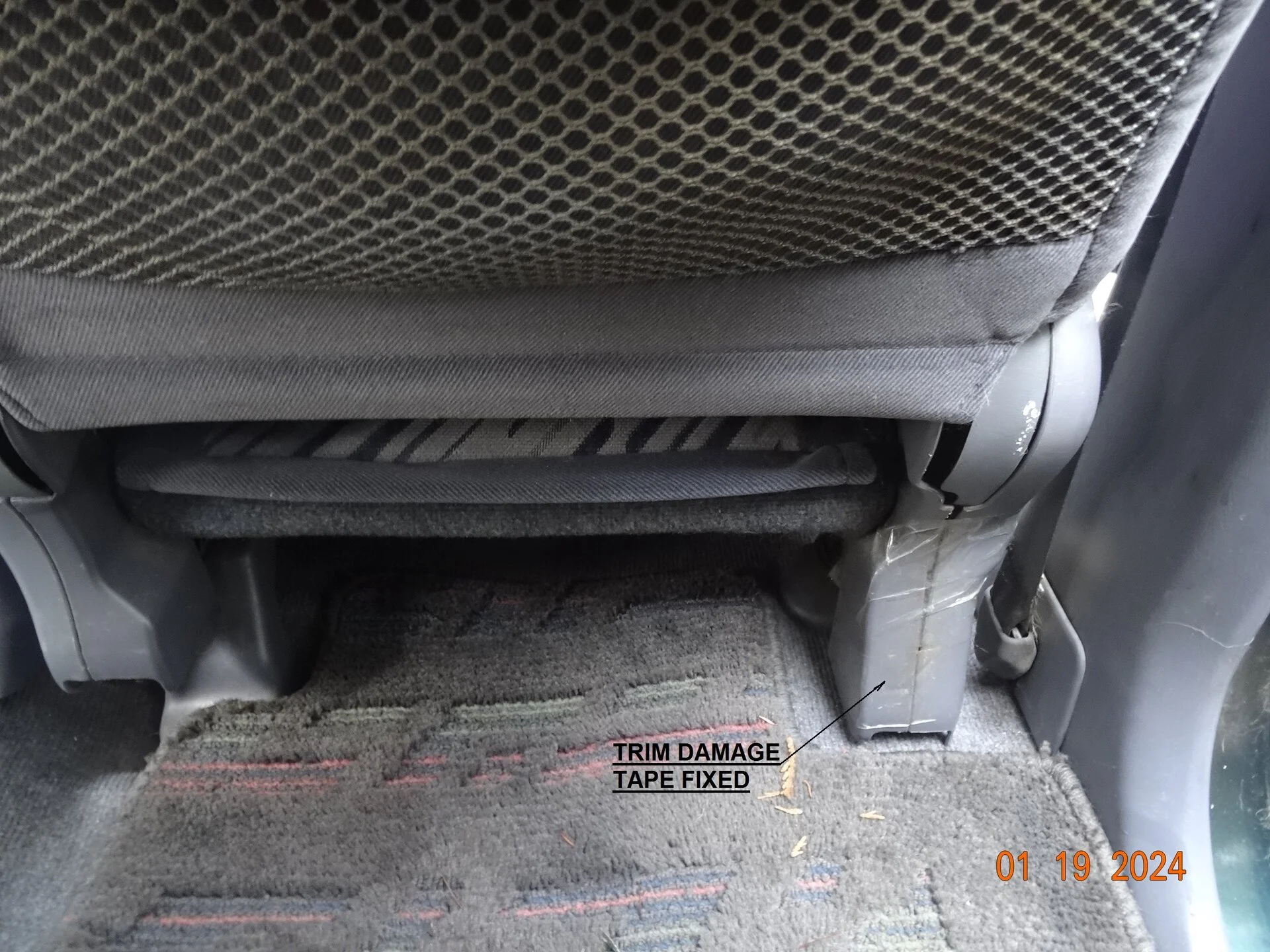 Driver seat lower trim damage.JPG