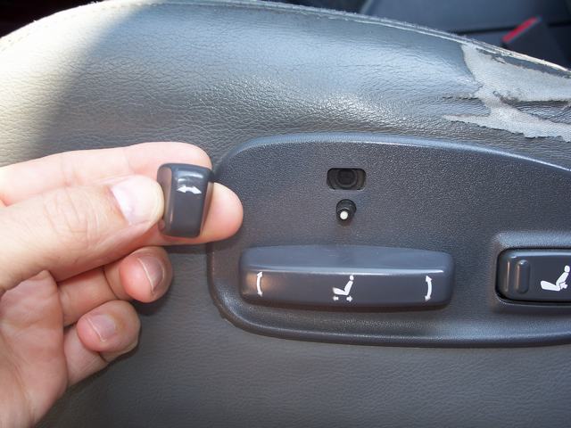 Drivers seat and broken button.JPG