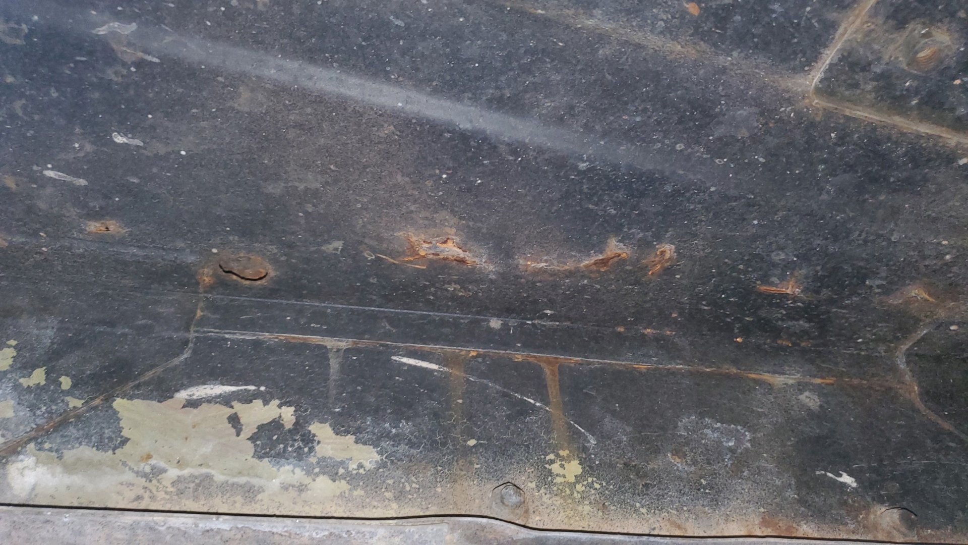 Driver's side under seat - only rust.jpg