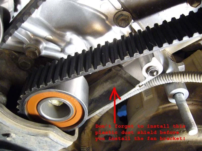 Dust Shield pic at water pump reassembly.webp