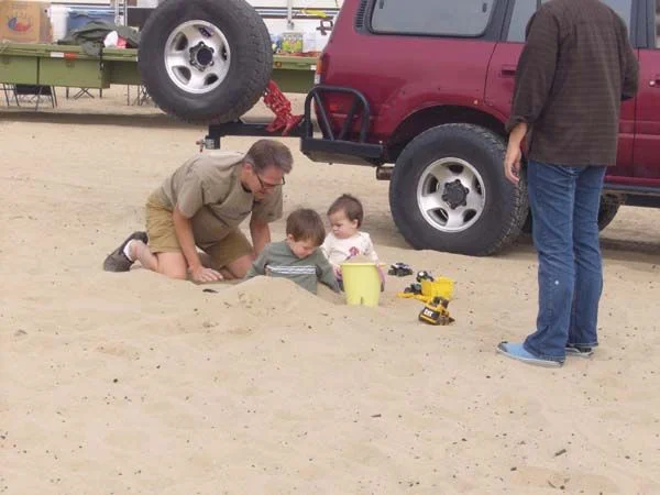 Everyone got sand in their toes (or toes in the sand).webp