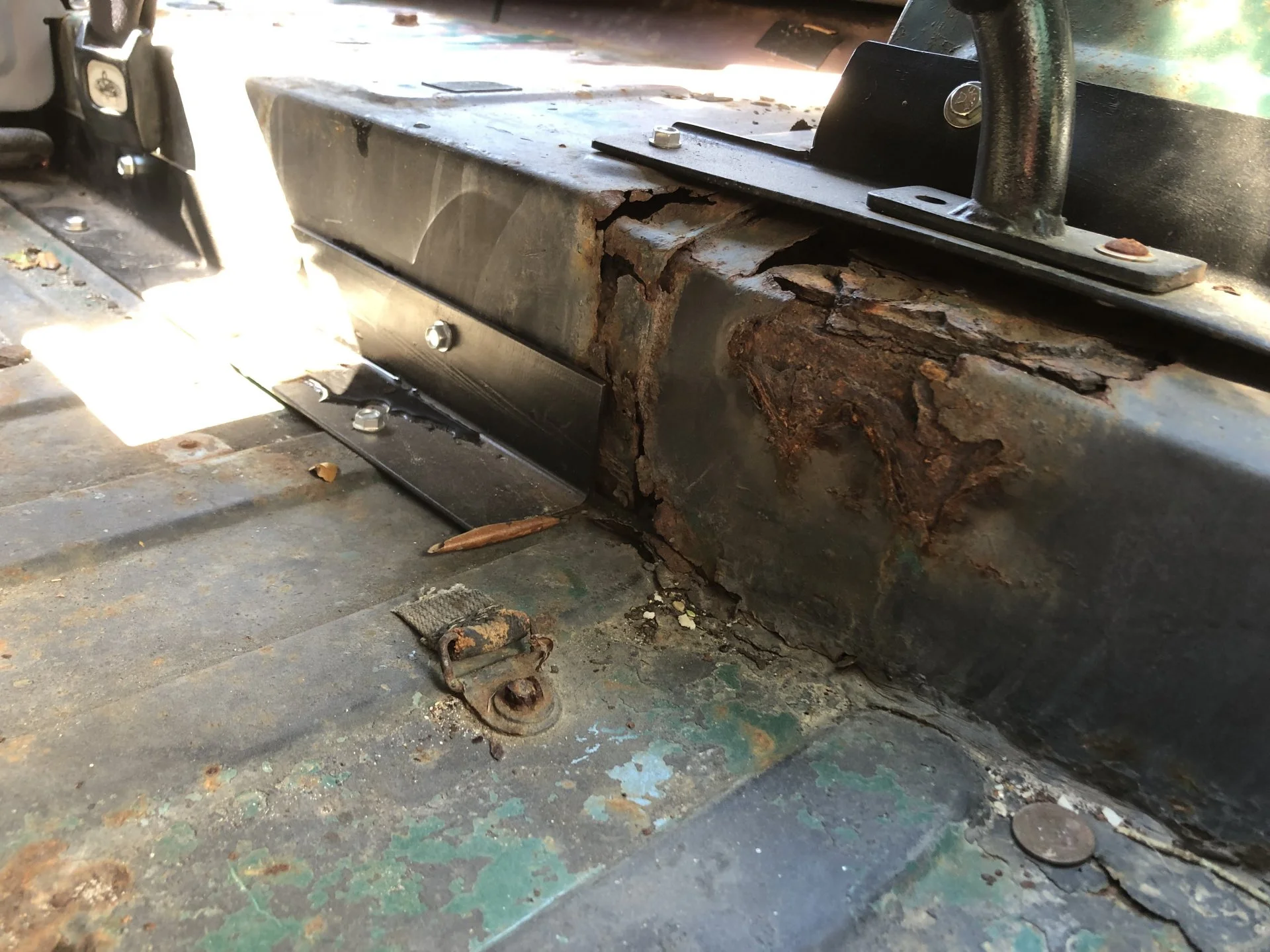FJ-DriverSider-FloorUnderFrontSeat.webp