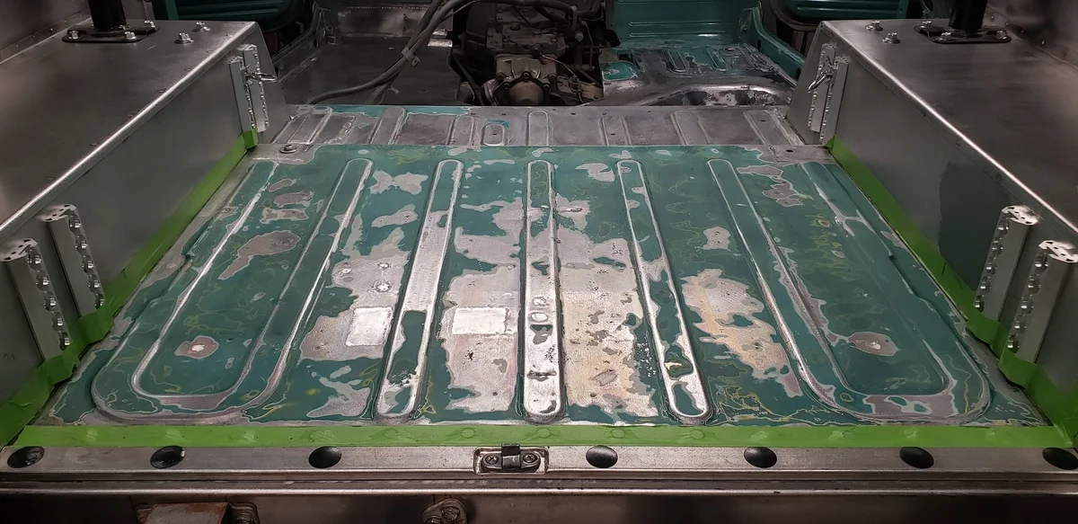 FJ40 rear floor, patched, treated, and ready for paint.webp