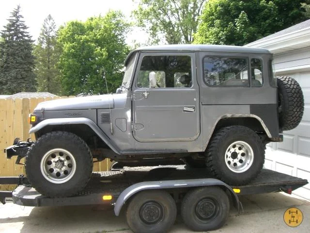 78 FJ40 with parts trucks.  Located in Grand Rapids, MI