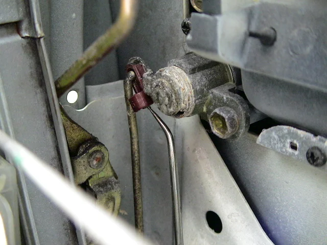 Front door lock cylinder rod snap.JPG