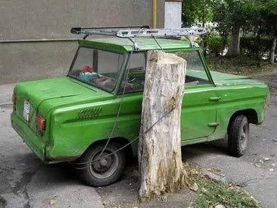 funny-humor-photo-car-chained-tree-stump.jpg