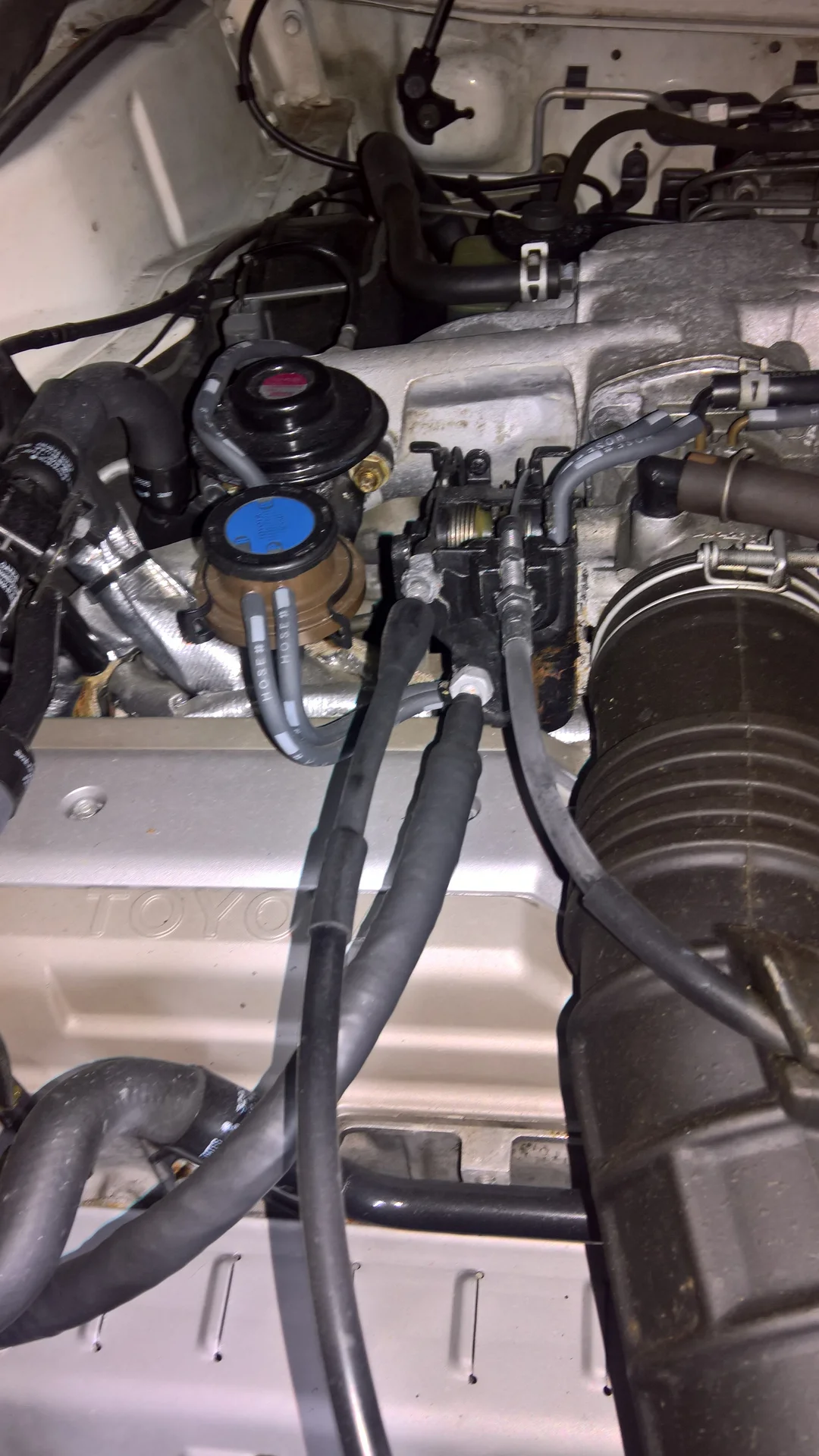 FZJ80 Throttle body cables passenger side view.png