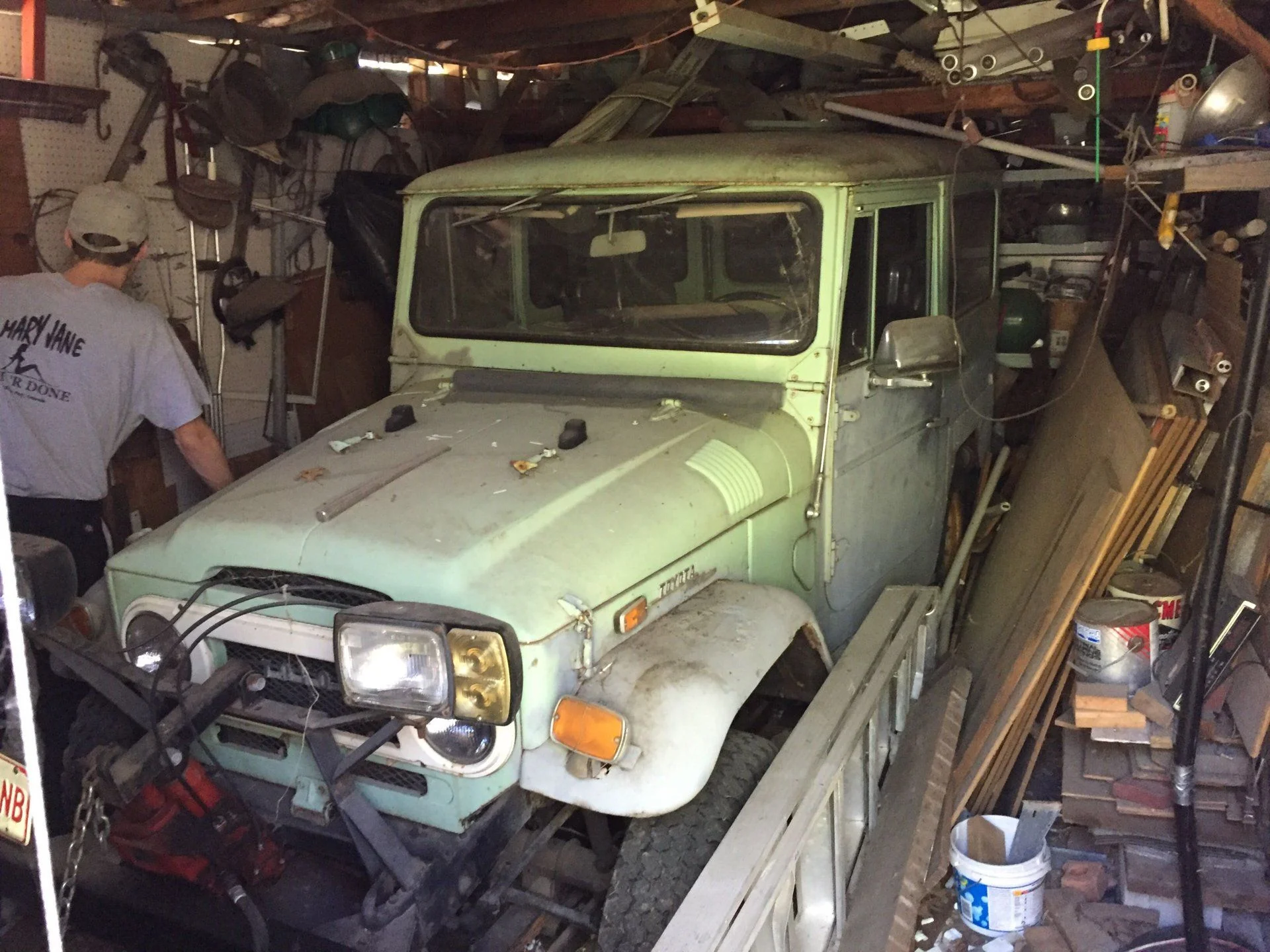 Green vehicle in garage 2.webp