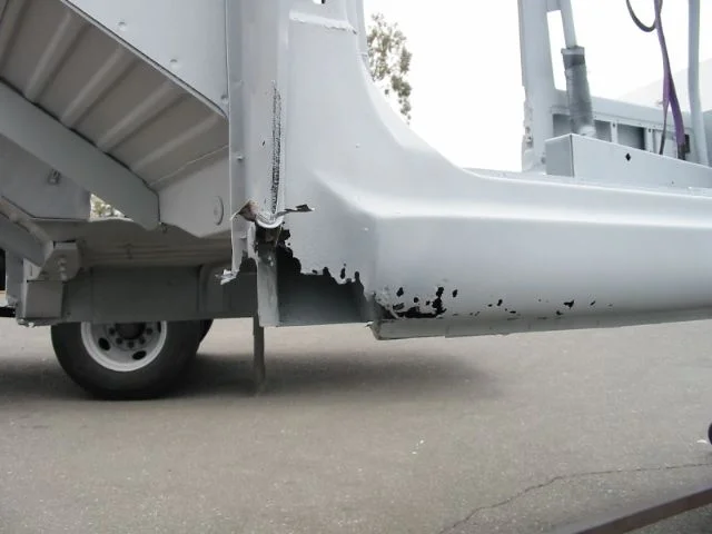 holes driver side front.webp