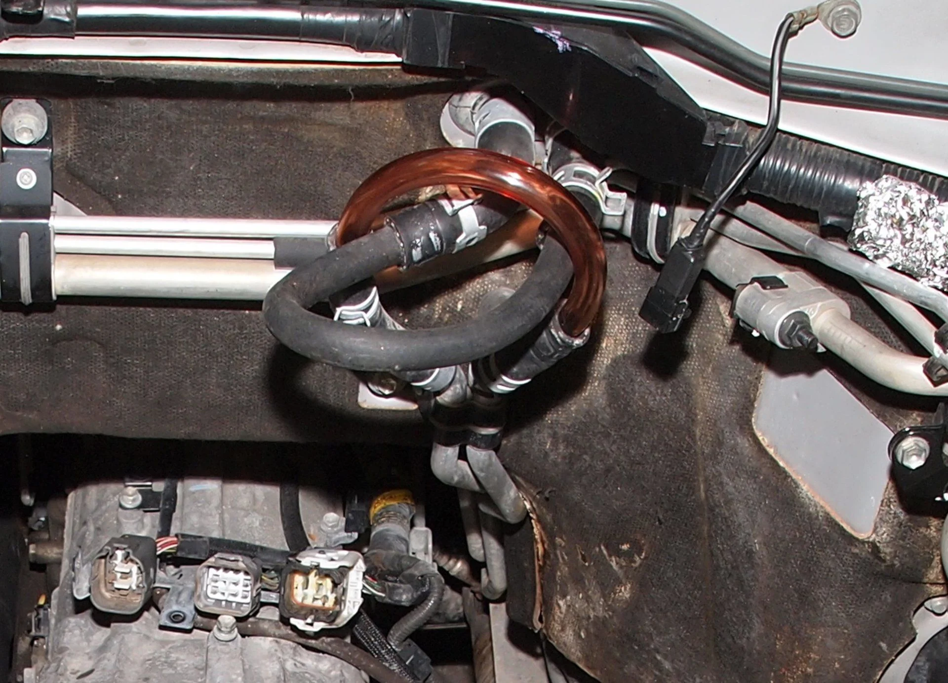 Hoses heater core at fire wall.webp
