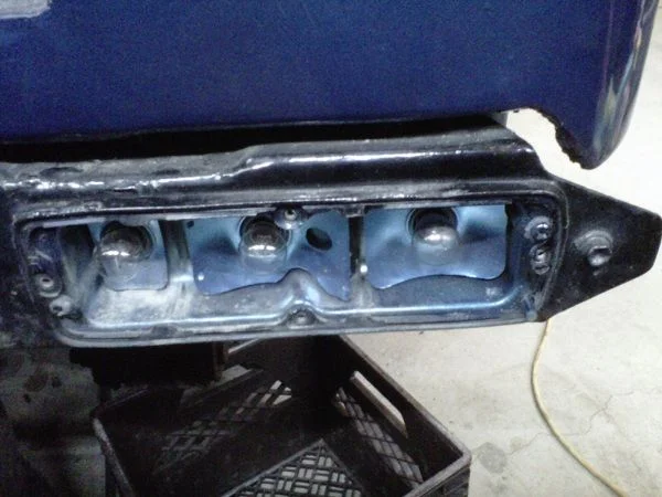 LC-20110501-001 - Rear Taillights with cover off showing gasket - P Side (Mud).webp