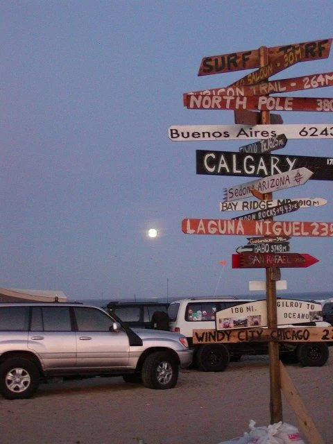 Moon set over sign pole.webp