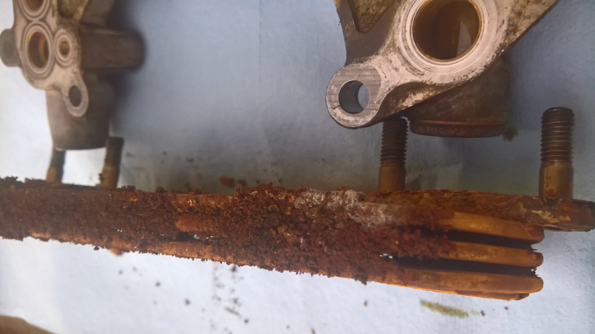 OIl cooler plate covered in rust.jpg