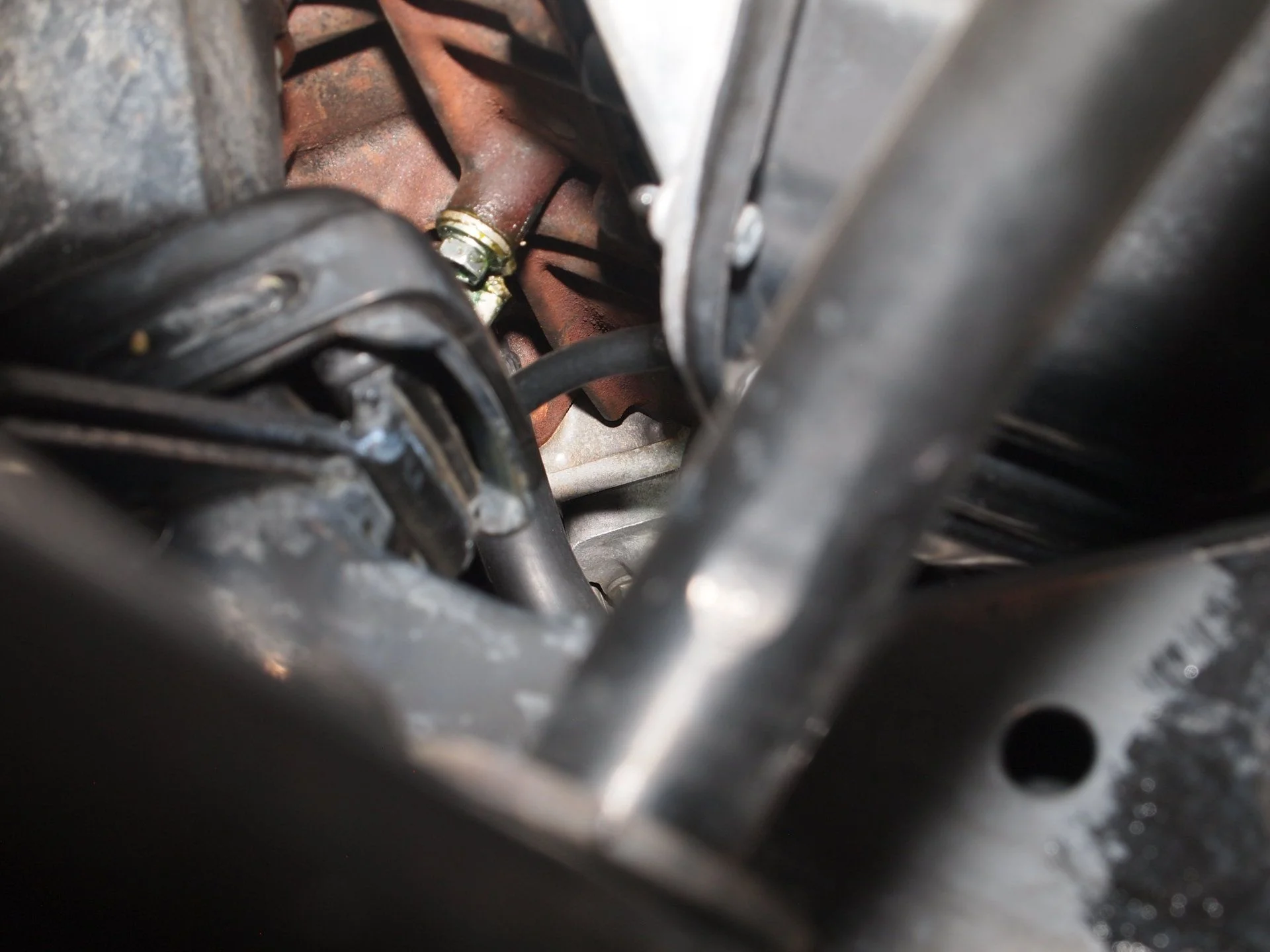 Oil filter bracket after fix and first cleaning.  Recleaned and will inspect again Rear view.webp