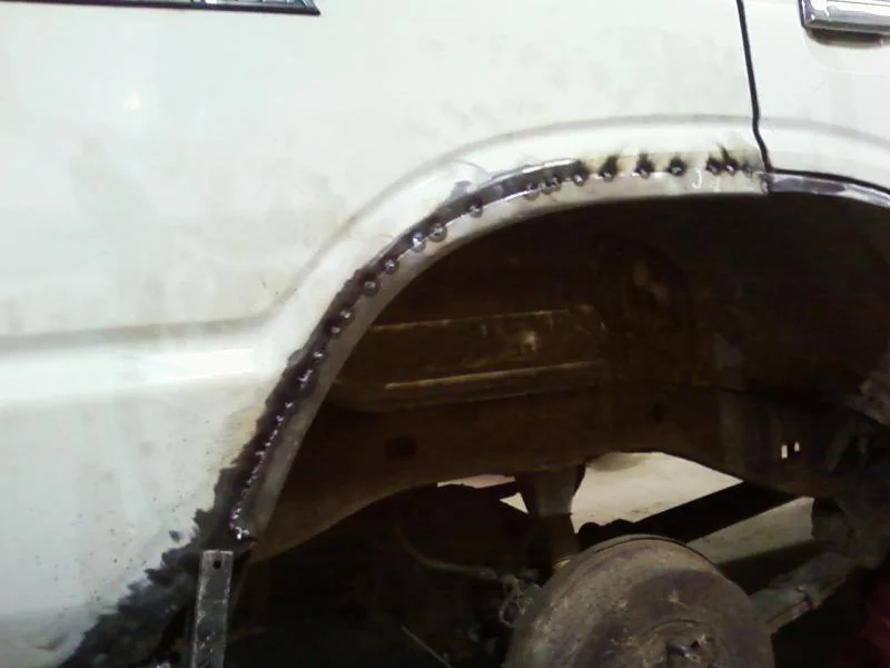Passenger rear well, tacked.webp