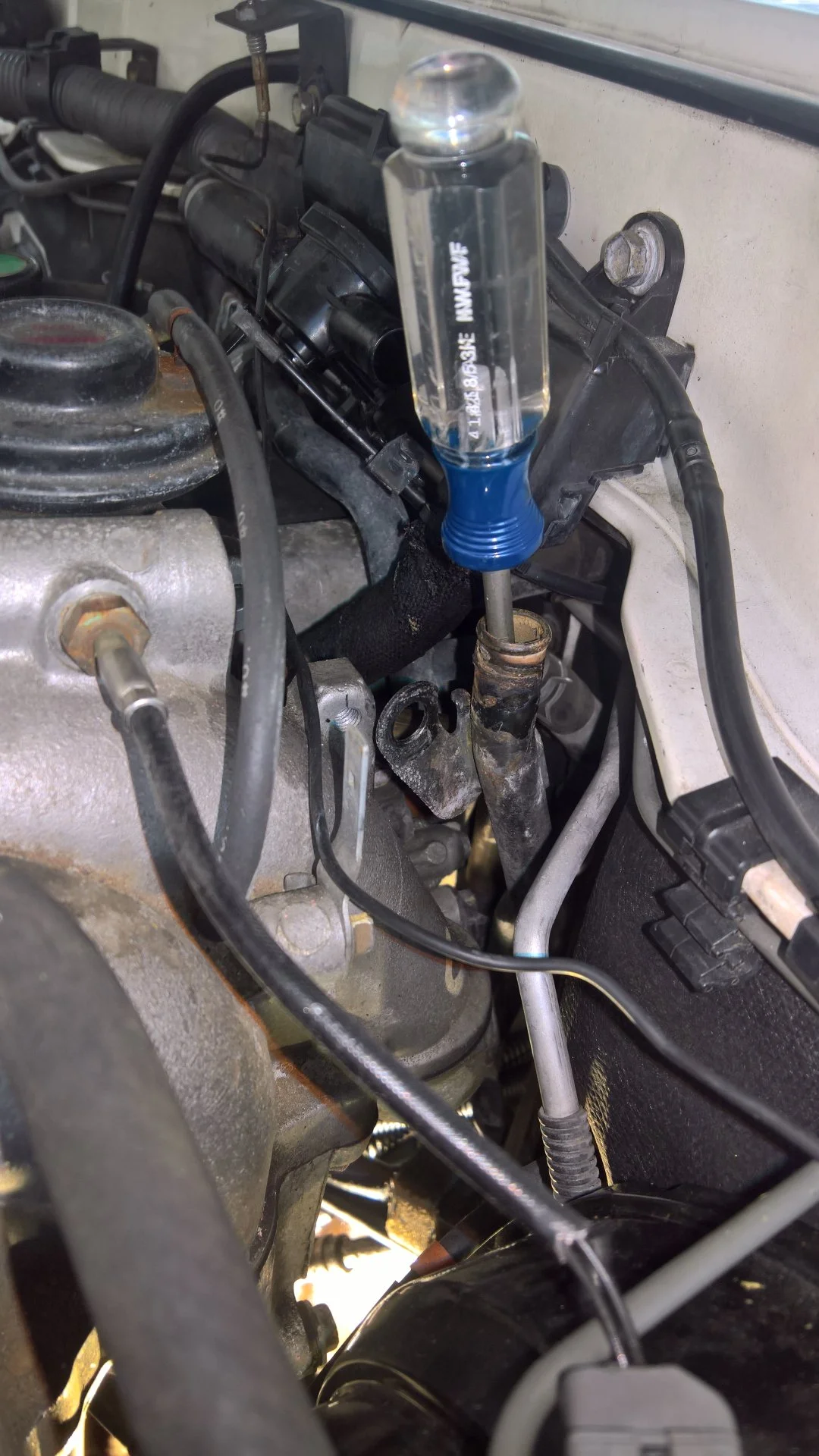 PHH pipe removal by wiggling with screwdriver.jpg