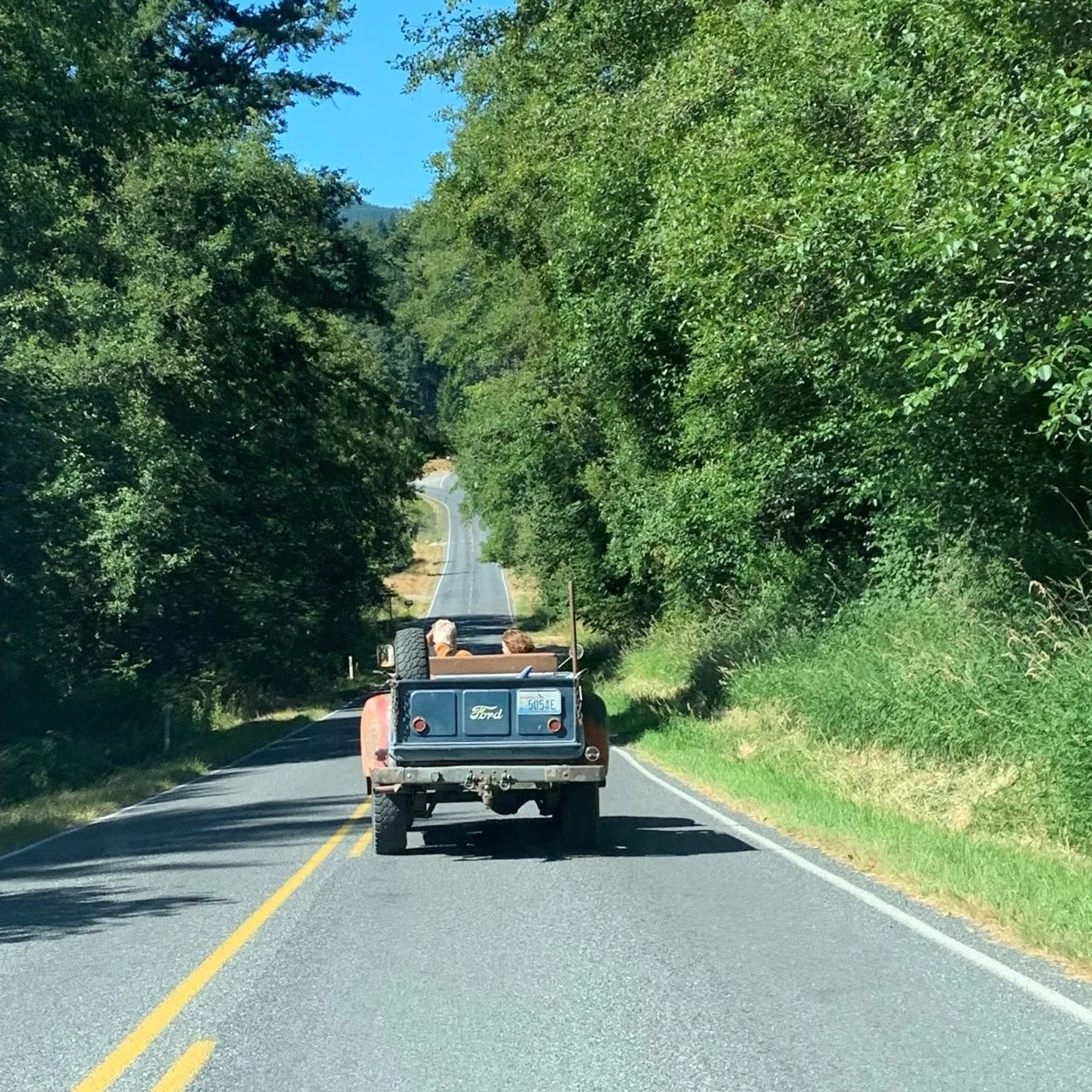 Pops and KK in blue truck.webp