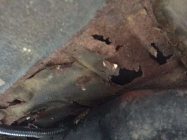 Red - Floor Rust above gas tank.webp