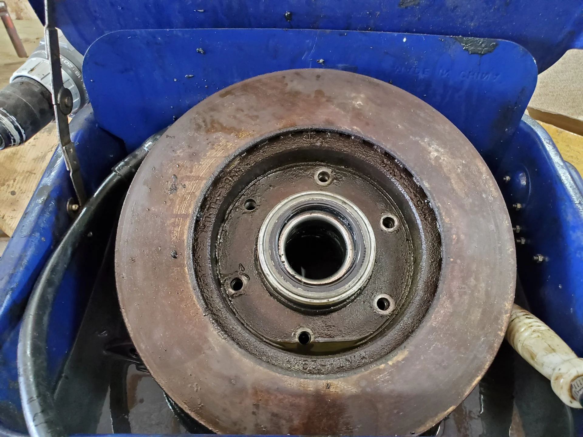 REMOVED BOLTS HOLDING ROTOR TO THE WHEEL HUB.webp