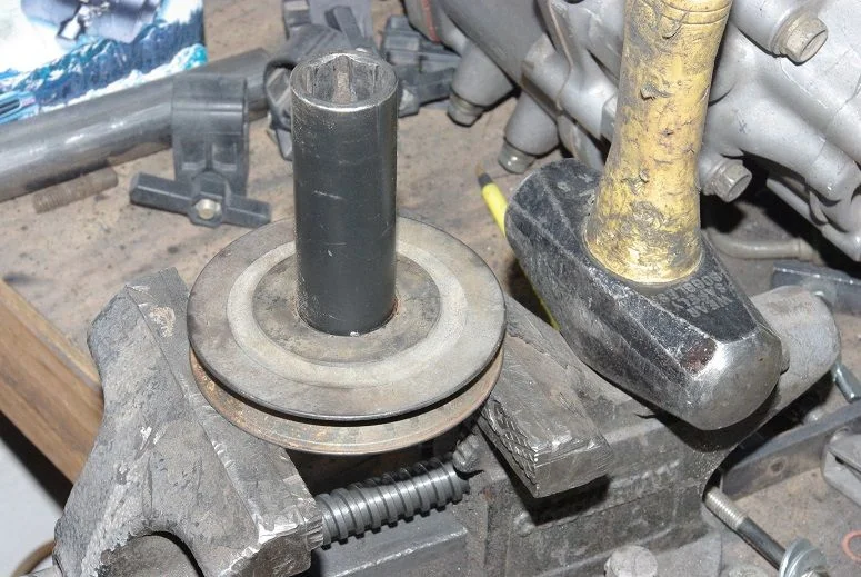 Removing bearing with hammer-sm.webp
