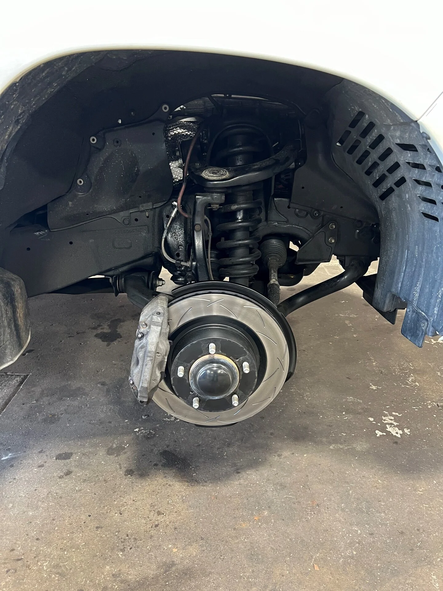 Rotors brakes hoses installed.jpg