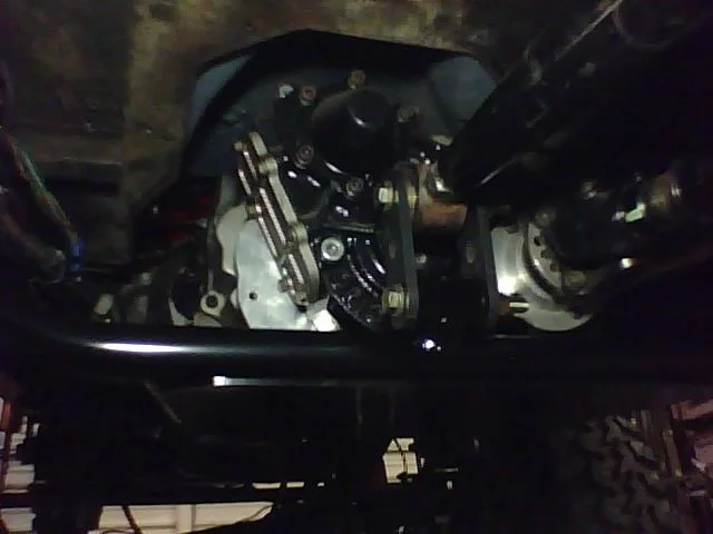 Skidplate installed at traction bar.webp