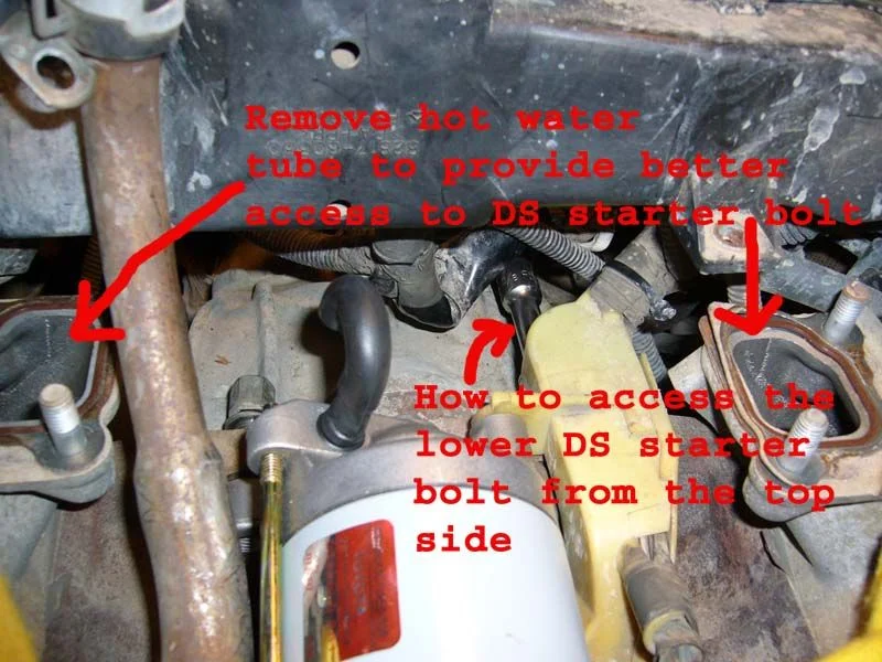 Starter lower bolt access and water tube pic.webp