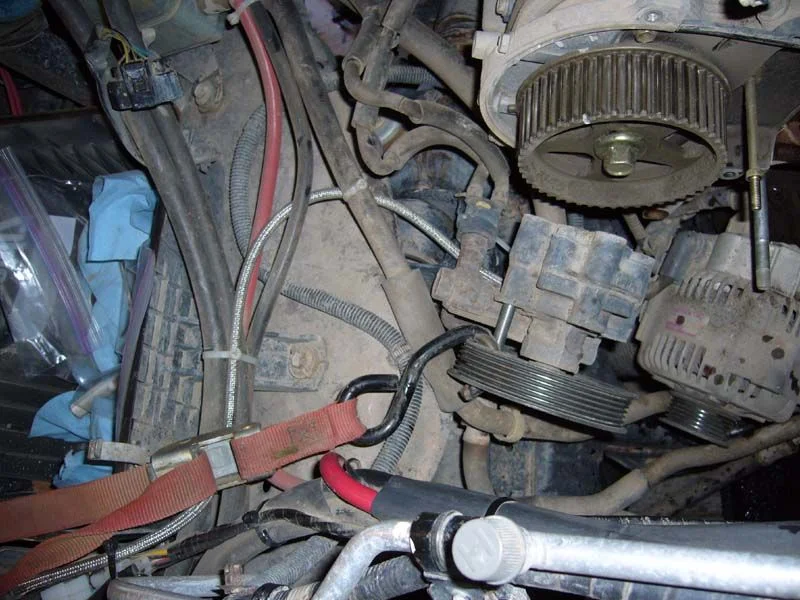 Strap holding smog pump pic.webp