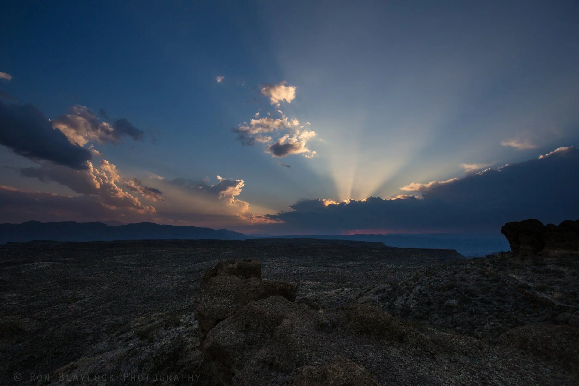 sun doing down behind clouds at Guale.webp