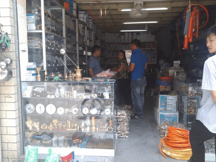 the gauge and fitting shop in china market.webp