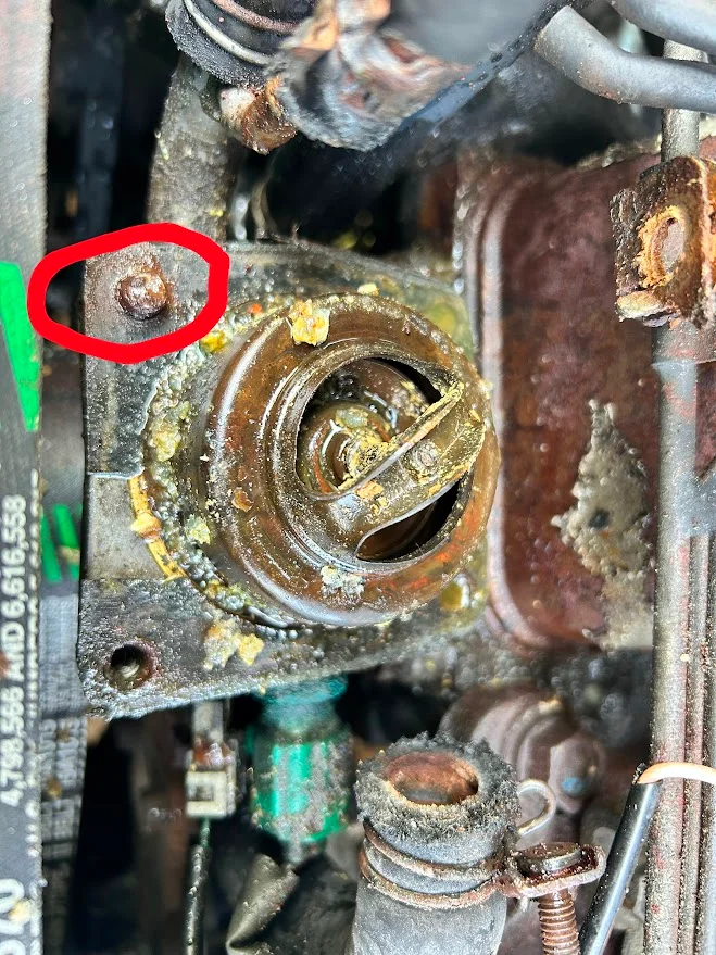 Thermostat housing broken bolt.webp