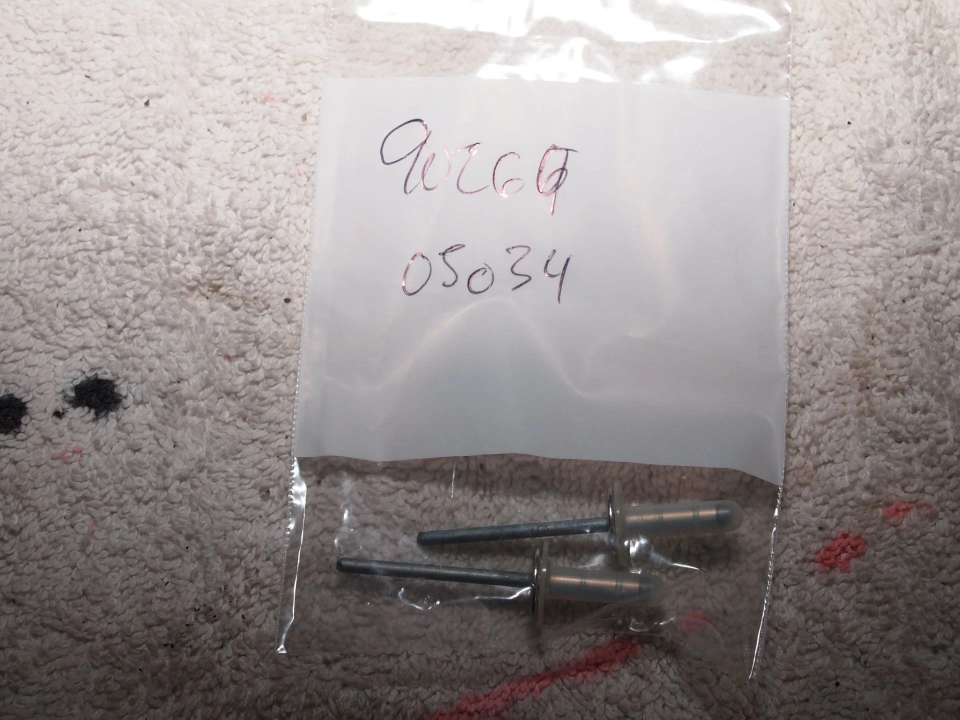Toyota rivets. can be used when windshield side molding  is oversized-drilled.webp