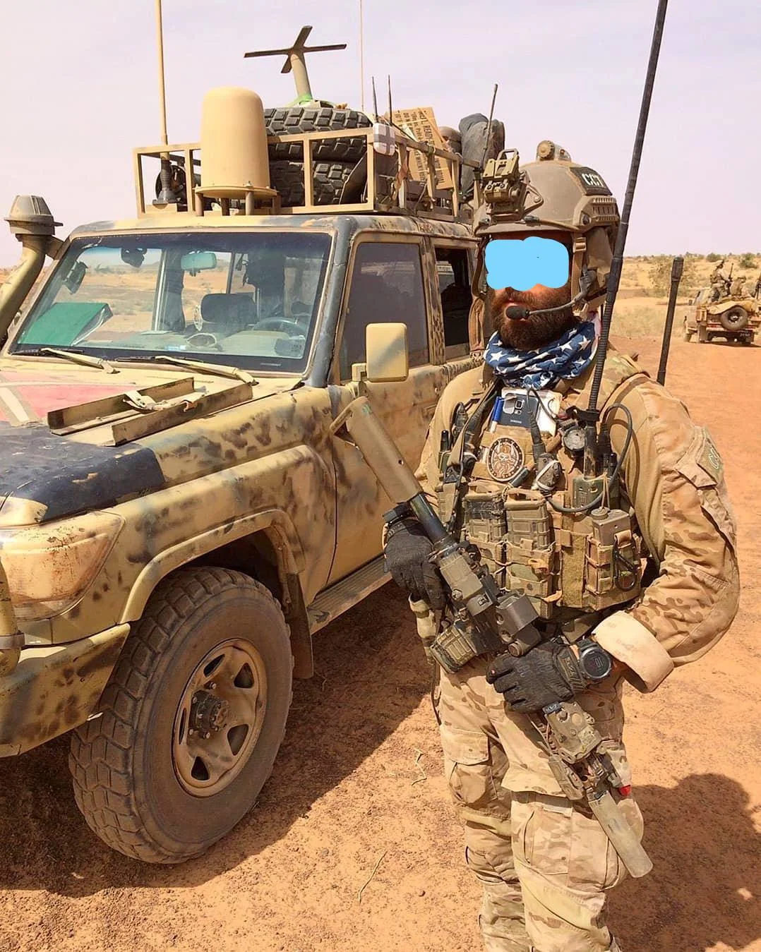 U.S. Air Force Combat Controller next to a 70 series Land Cruiser.jpg