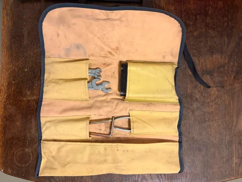 Yellow vinyl Toyota tool roll and tools