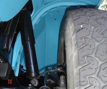 Prior to undersealing. (Note that the support-brace is "laddered" to enable access behind it for rust treatment and painting.)