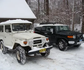 the new shoes- 9.5x33" BFG AT's next to the wife's FJC