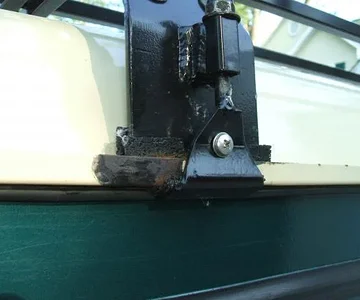 Damage caused by original bracket coming loose and damaging paint and gutter.