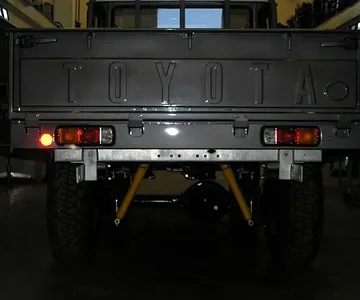 I made the top rail, side rails and the bottom channel of the tailgate including the M6 captured nuts for the hinges - again, Ryan put it together which imho is the hard part. He used the skin and hooks from the original gate.