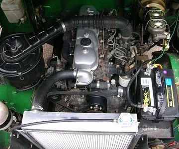 After installing an aluminum radiator, electric fan, corvette style brake master cylinder, new water pump, rebuilt alternator, powder coating and refinishing many parts, this is the (after) photo of the 1980 BJ40 engine compartment...Not bad for a daily d